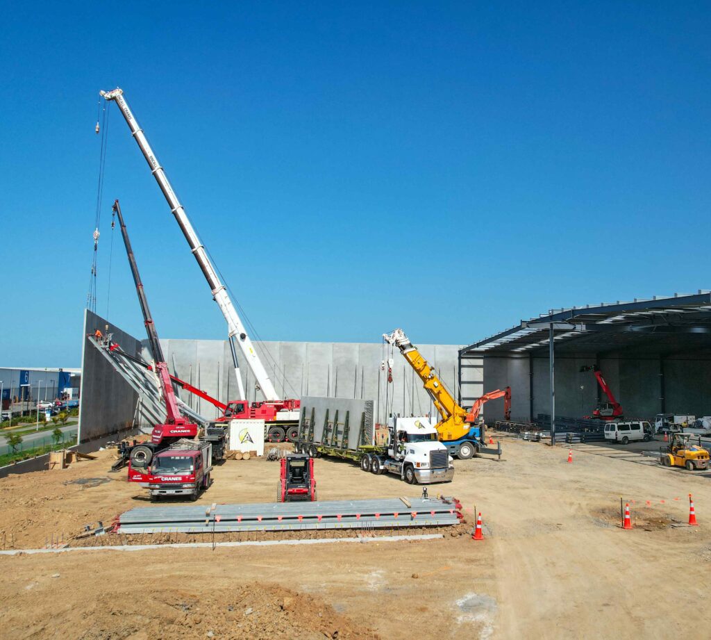 Healthy n Fresh Warehouse construction showing cranes, trucks & various machinery